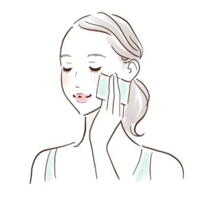 油分をティッシュオフする女性